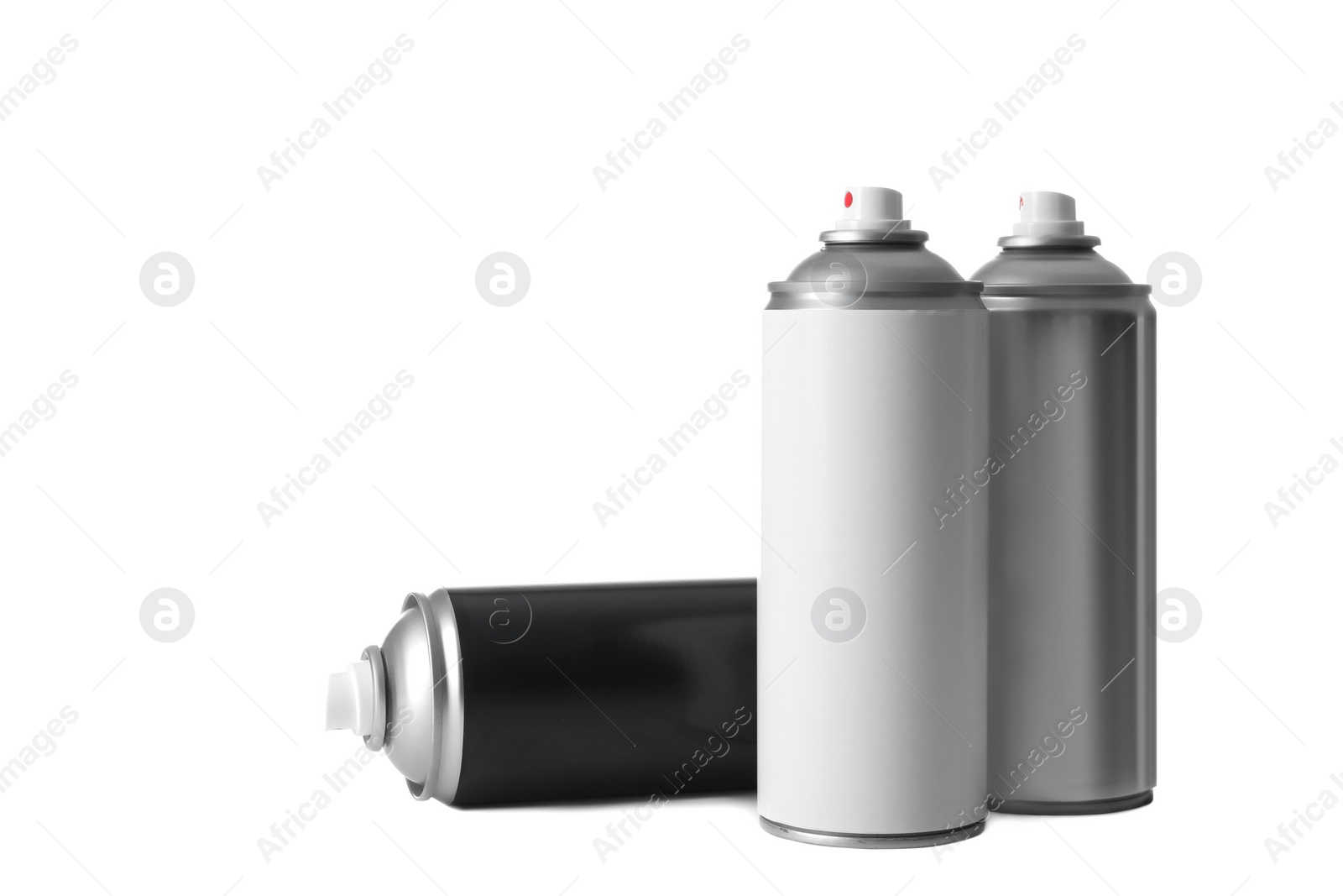 Photo of Cans of different spray paints on white background