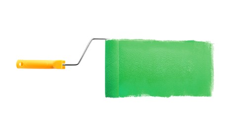 Photo of Roller brush with light blue paint on white background