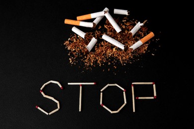 Photo of Word Stop made of matches and broken cigarettes on black background, above view. Quitting smoking concept