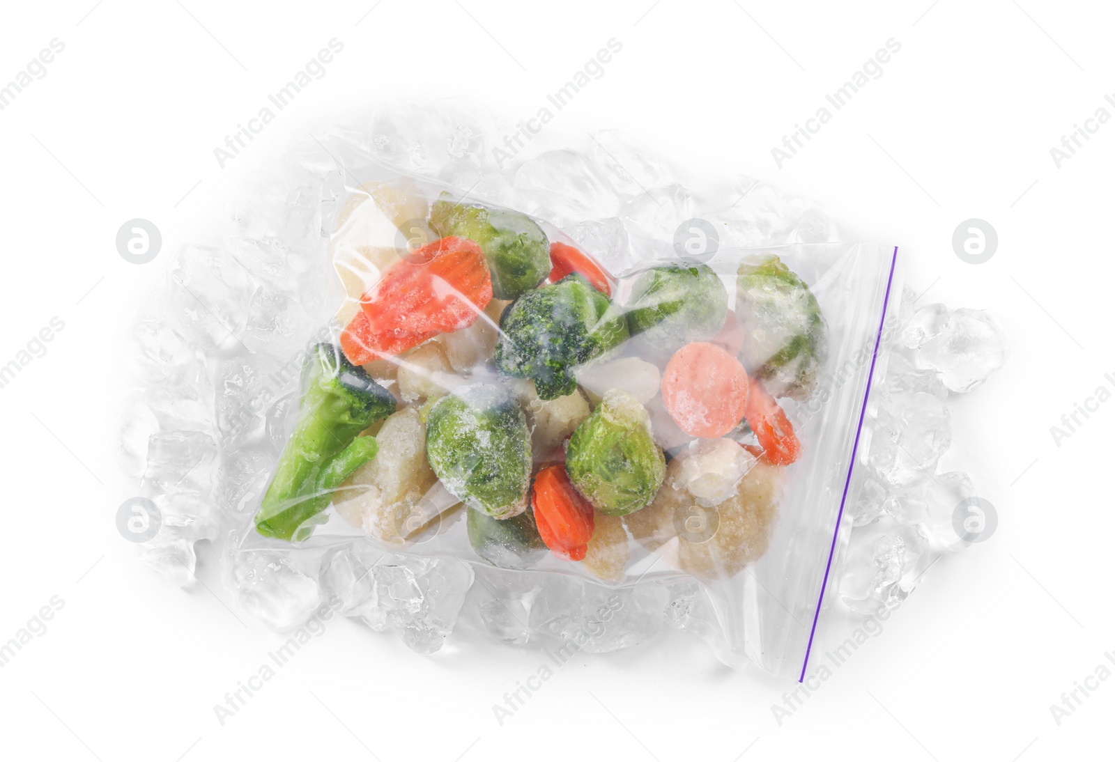 Photo of Mix of different frozen vegetables with ice isolated on white, top view