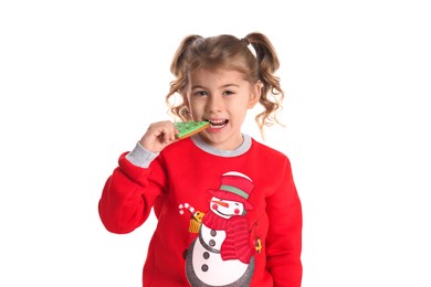 Cute little girl with Christmas gingerbread cookie on white background