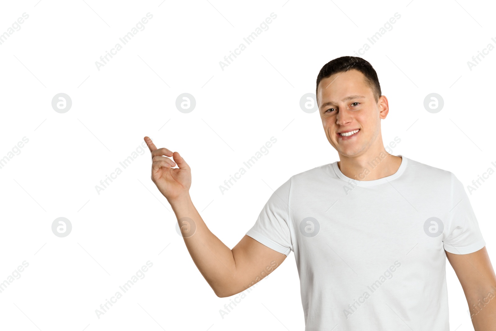 Photo of Handsome young man near white brick wall