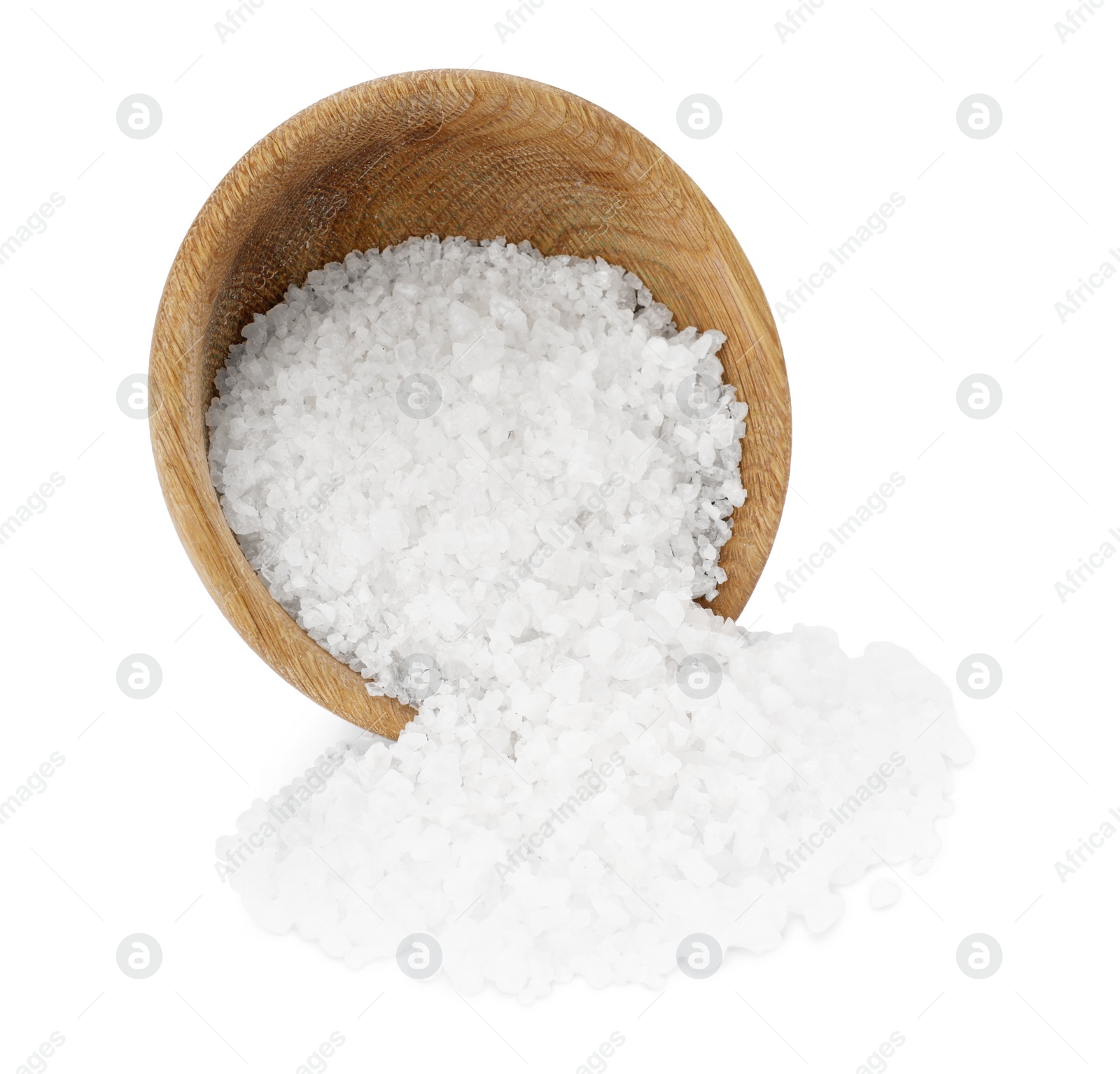 Photo of Overturned bowl with sea salt isolated on white