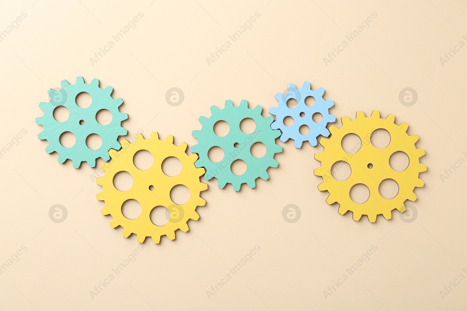 Photo of Business process organization and optimization. Scheme with colorful figures on beige background, top view