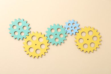 Business process organization and optimization. Scheme with colorful figures on beige background, top view