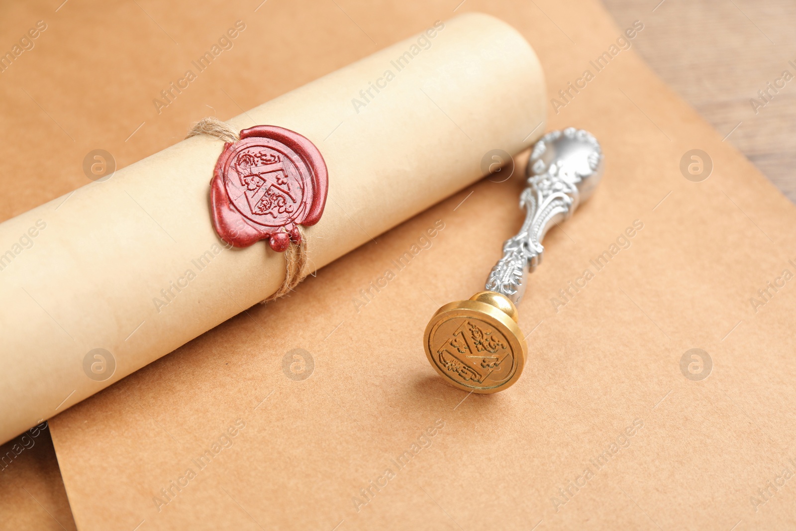 Photo of Notary's public pen and document with wax stamp on table