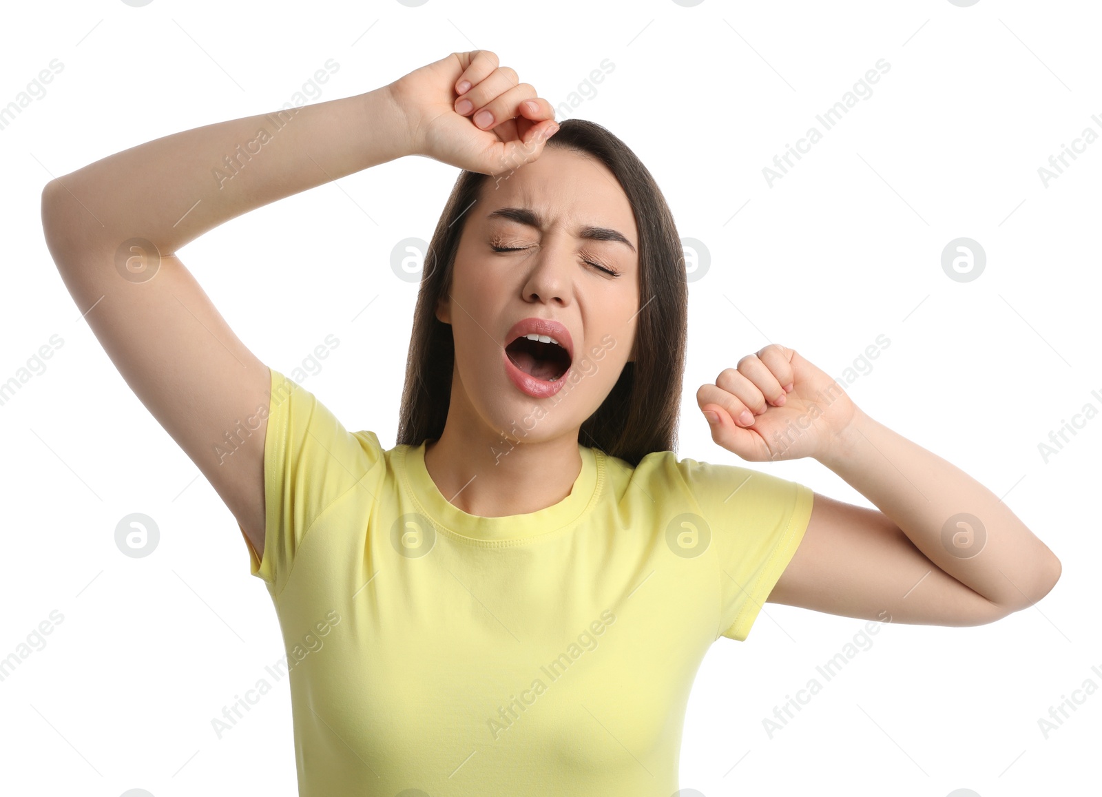 Photo of Young tired woman yawning on white background