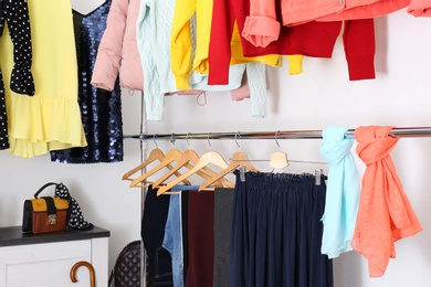 Modern dressing room with different stylish clothes and accessories