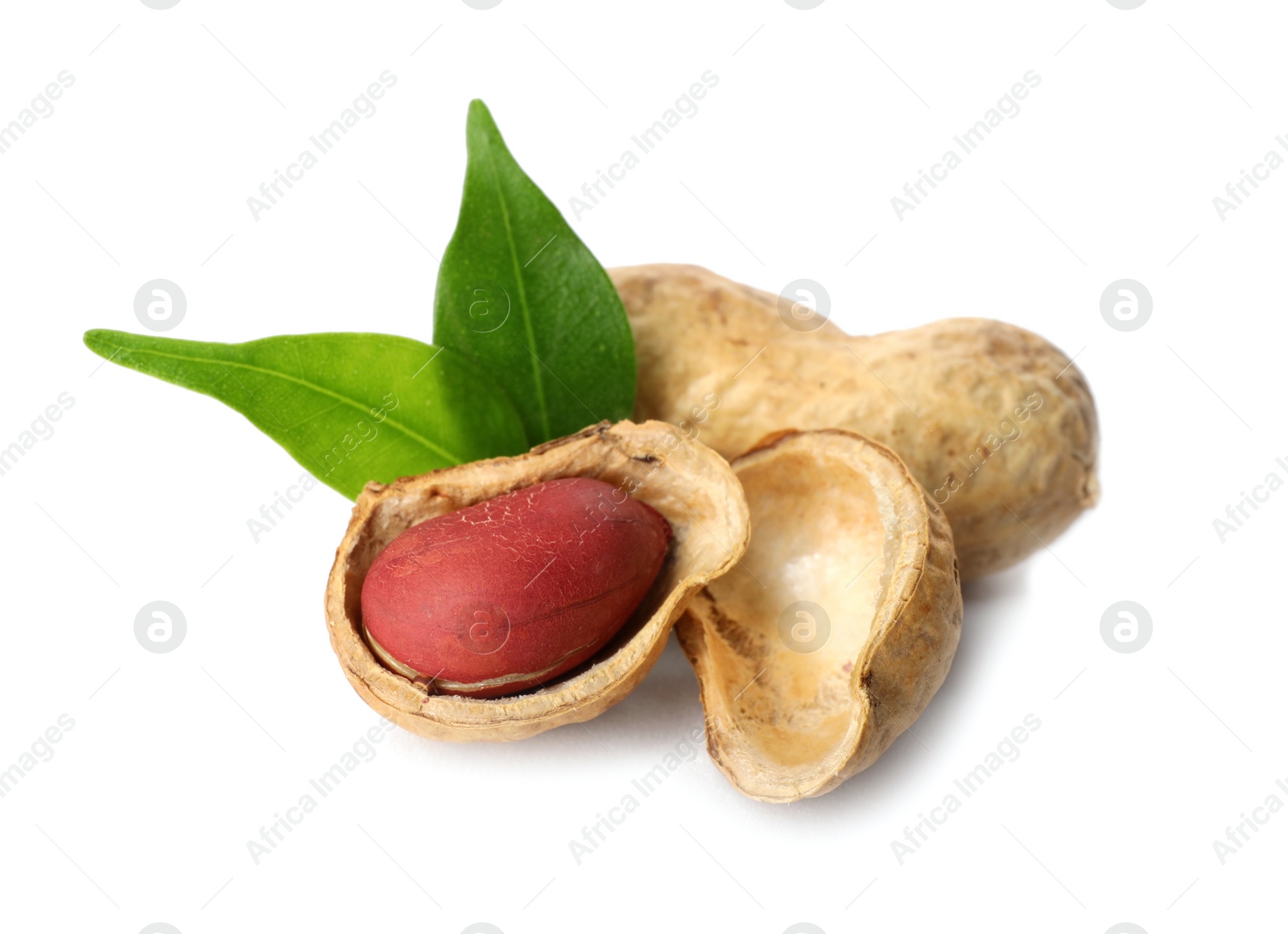 Photo of Raw peanuts and leaves on white background. Healthy snack