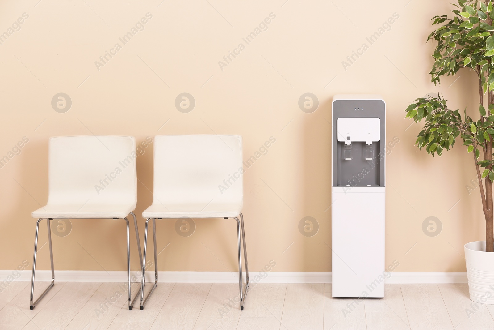 Photo of Modern water cooler in stylish office interior