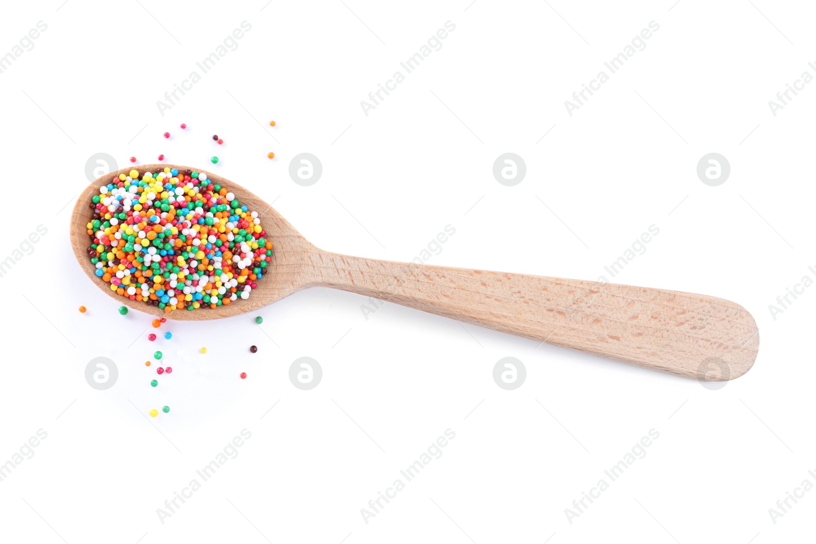 Photo of Colorful sprinkles in spoon on white background. Confectionery decor