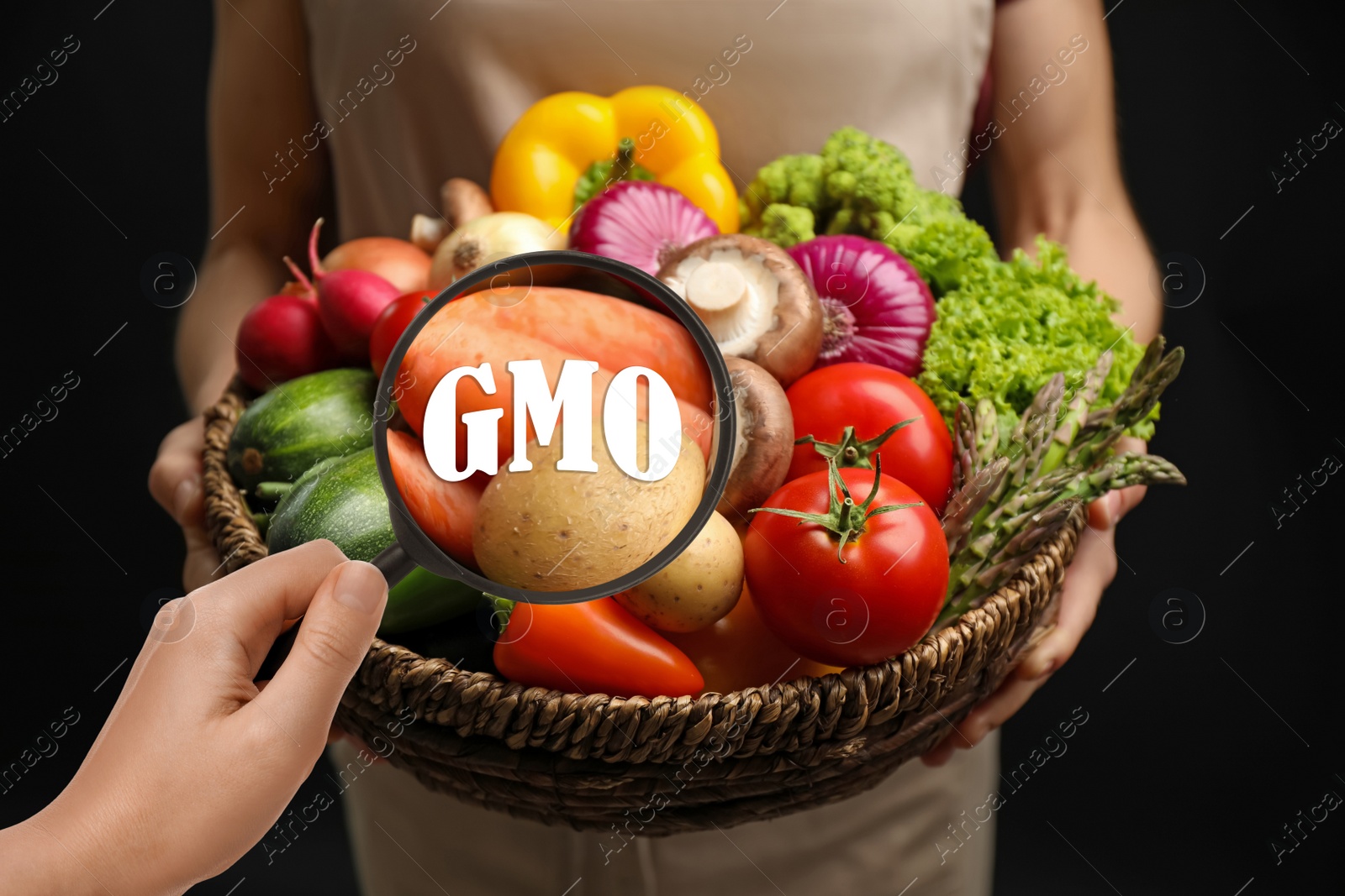 Image of View through magnifying glass on fresh vegetables. GMO concept