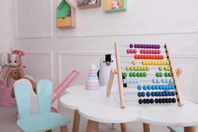 Cute child's playroom with toys and modern furniture. Interior design