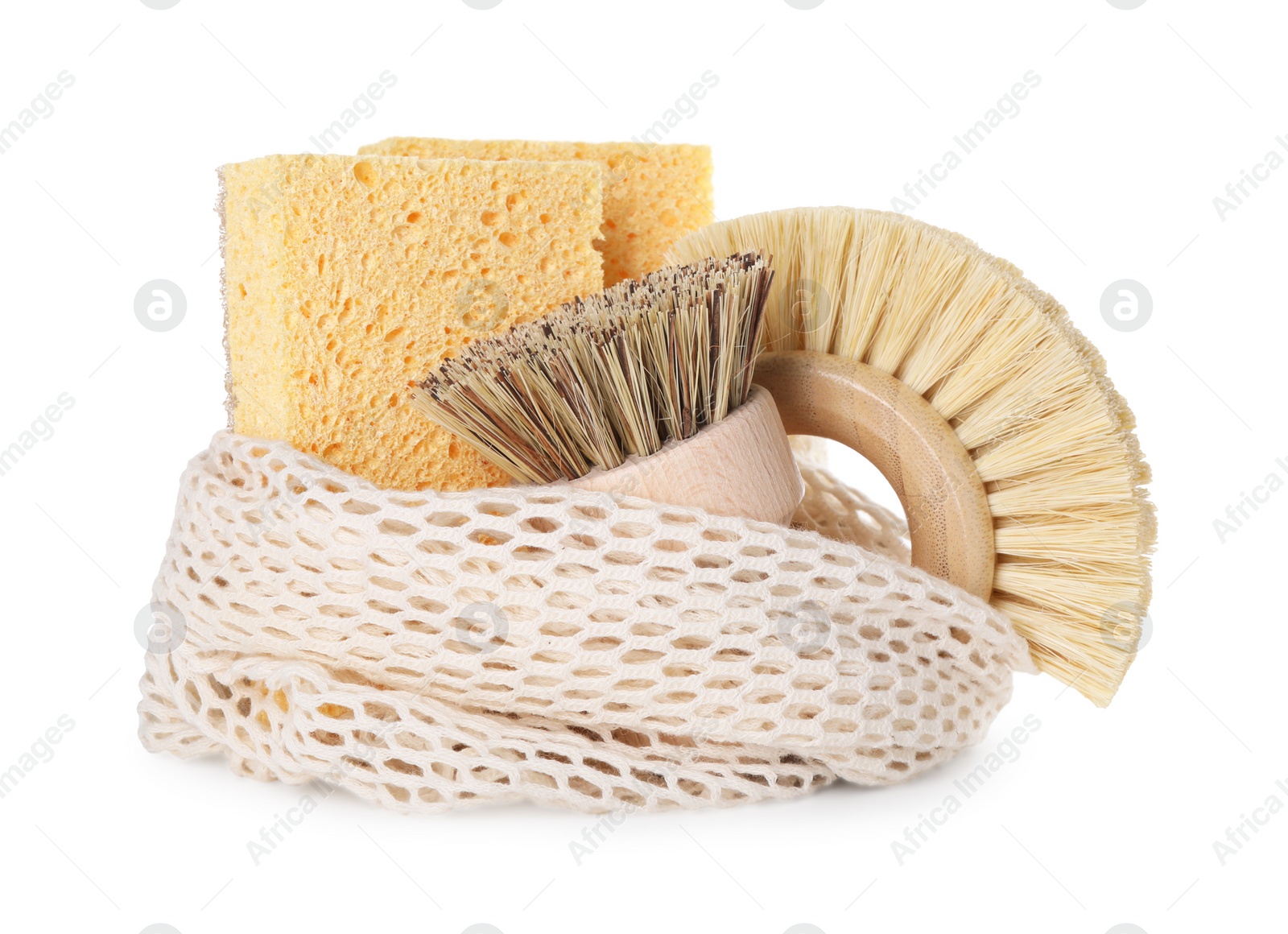 Photo of Cleaning supplies. Brushes, sponges and net bag isolated on white