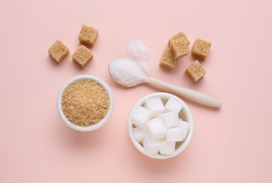 Different types of sugar on pink background, flat lay