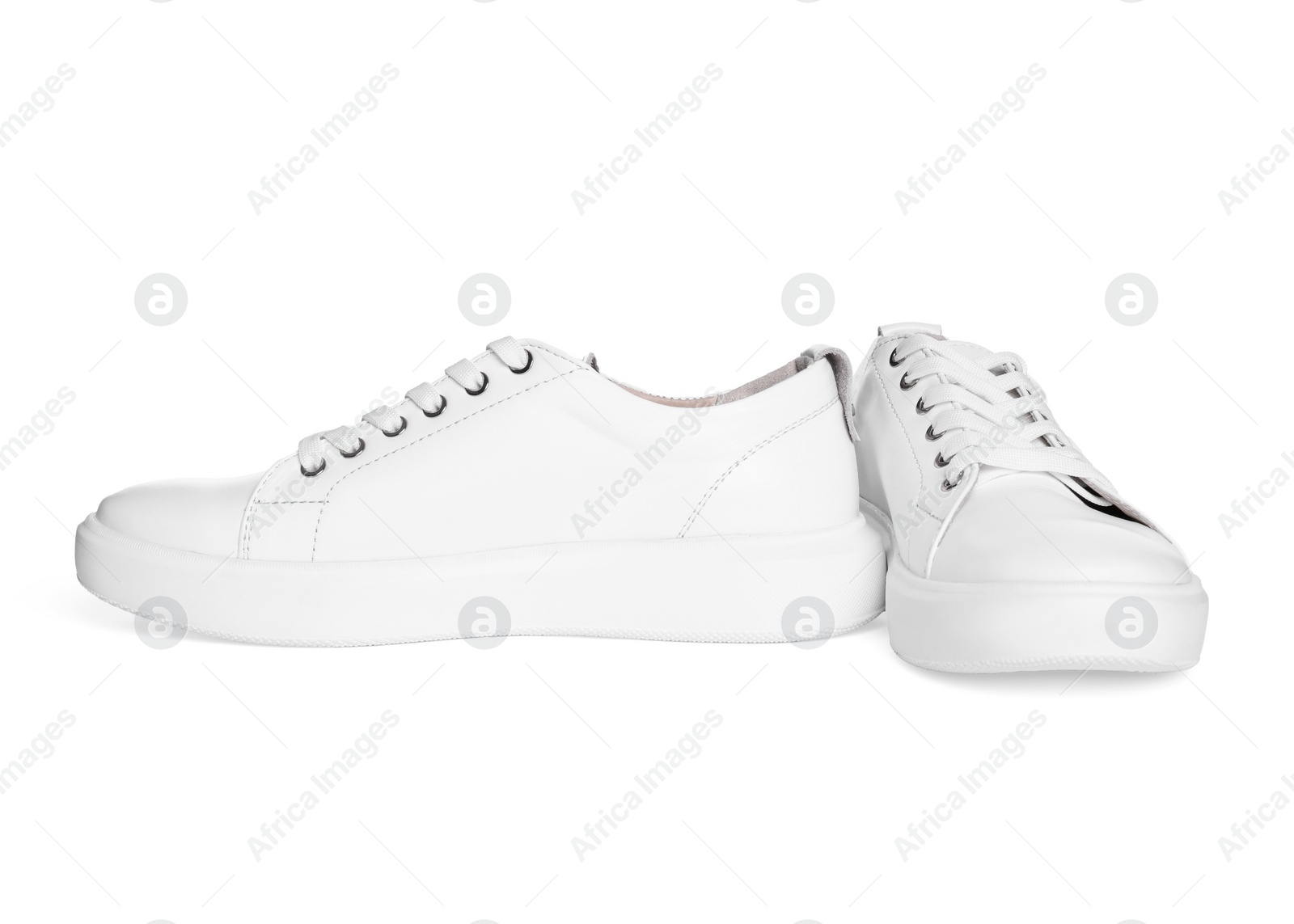 Photo of Pair of stylish sneakers isolated on white