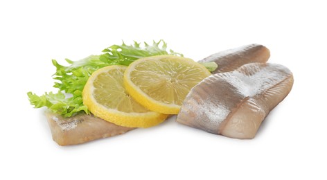 Photo of Delicious salted herring fillets with lettuce and lemon slices on white background