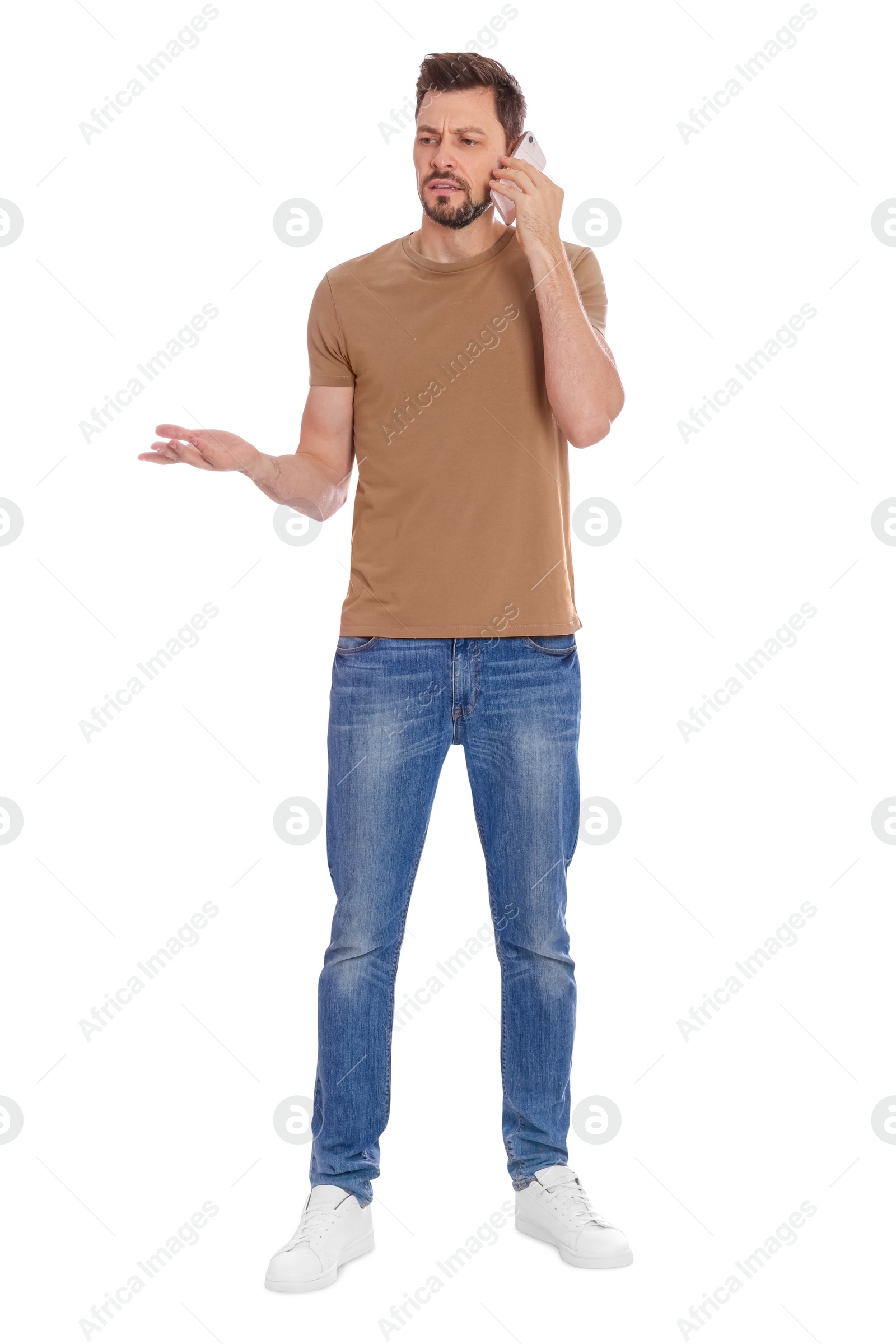 Photo of Man talking on phone against white background