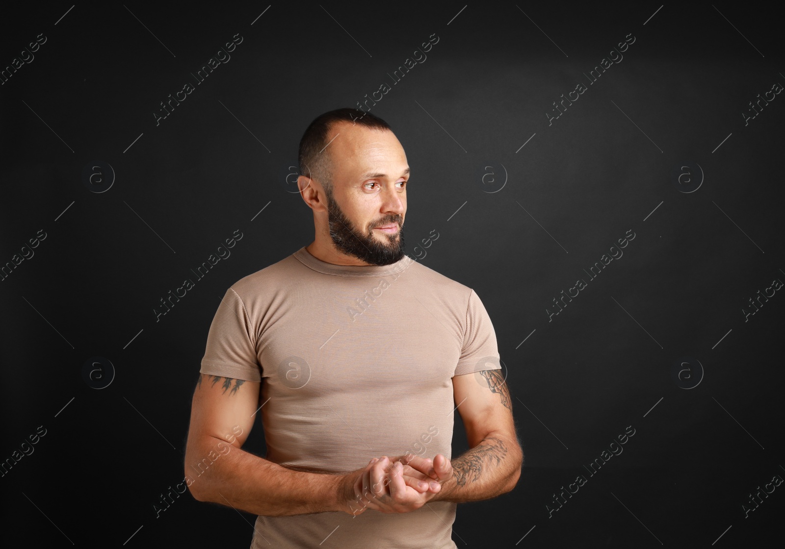 Photo of Portrait of handsome man on black background