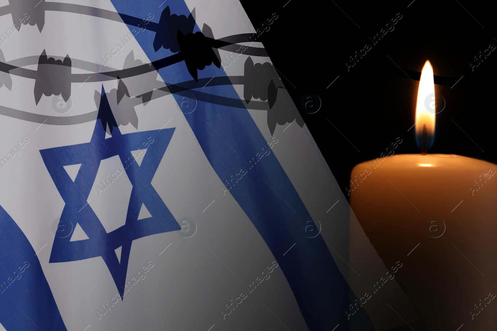 Image of Holocaust memory day. Double exposure with Flag of Israel and burning candle