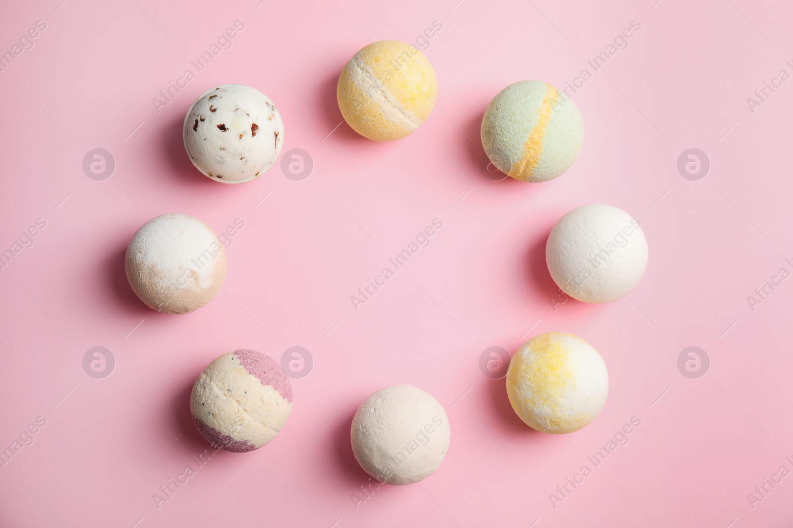 Photo of Flat lay composition with bath bombs and space for text on color background