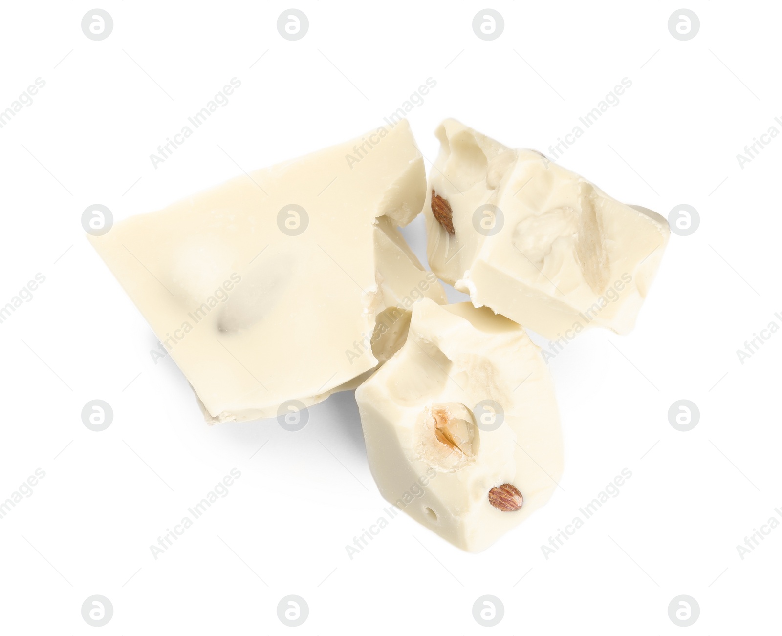 Photo of Pieces of delicious chocolate with nuts isolated on white, top view