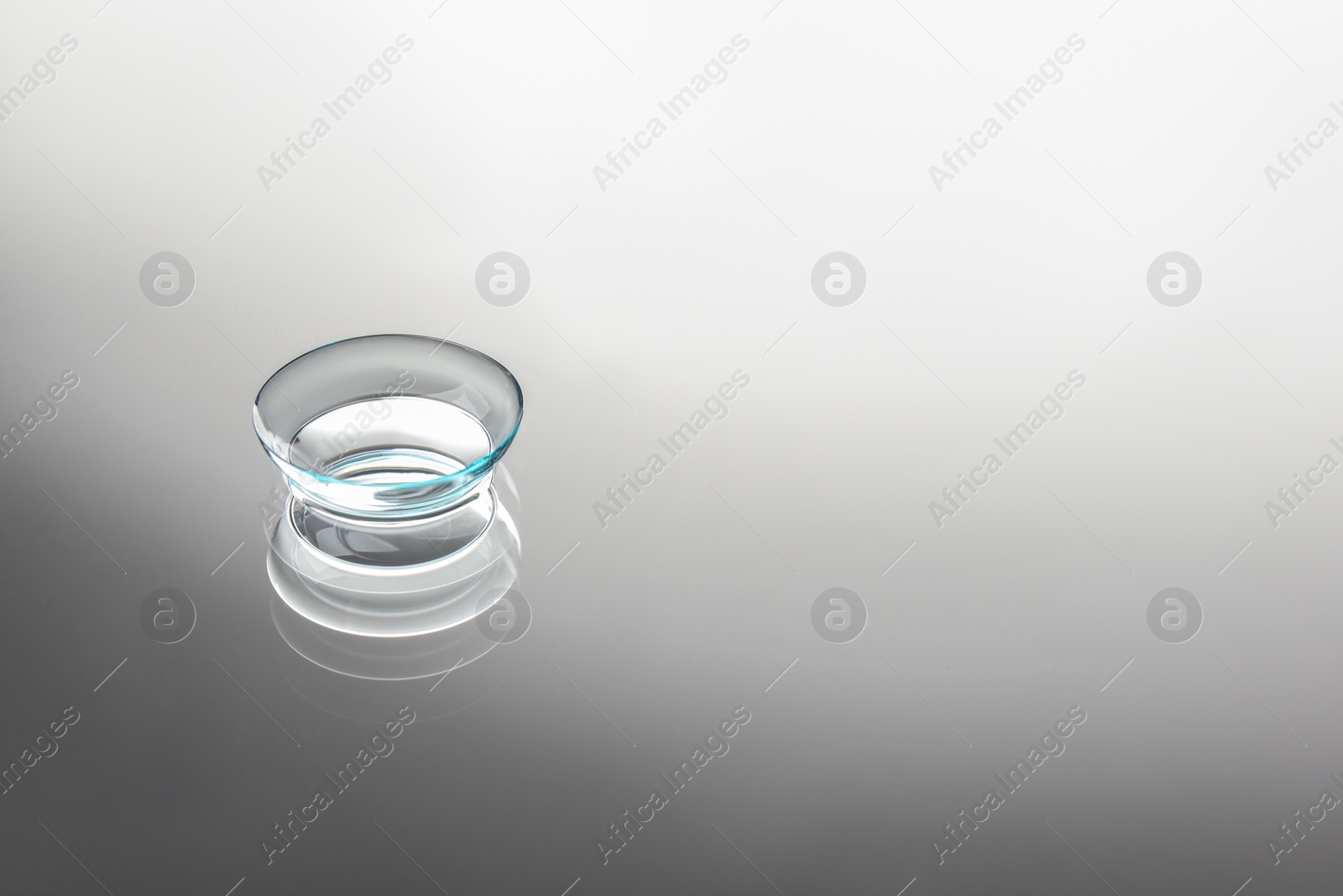 Photo of Contact lens on grey background