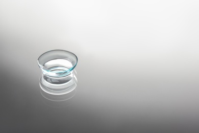 Photo of Contact lens on grey background