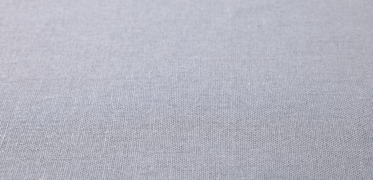 Texture of light grey fabric as background, closeup