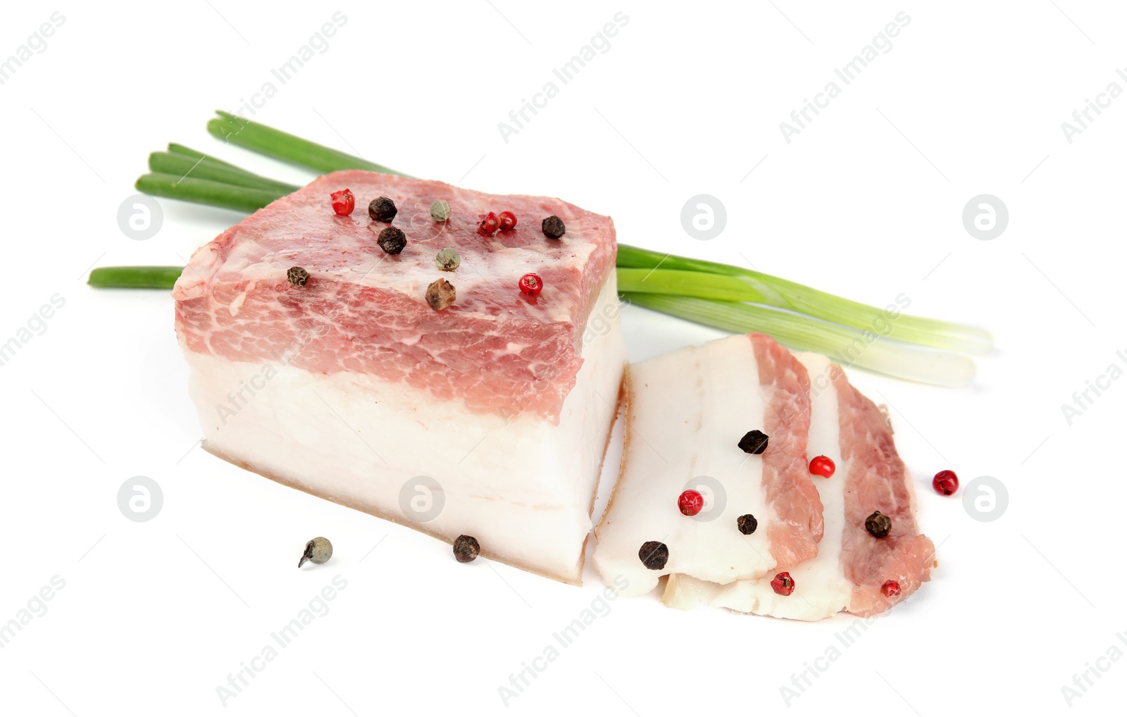 Photo of Cut pork fatback with onions and pepper isolated on white