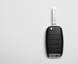 Photo of Car key on white background, top view. Space for text