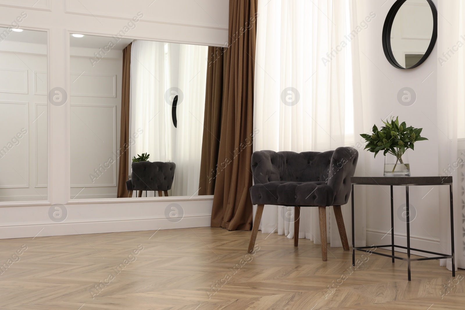 Photo of Modern living room with parquet flooring and stylish furniture