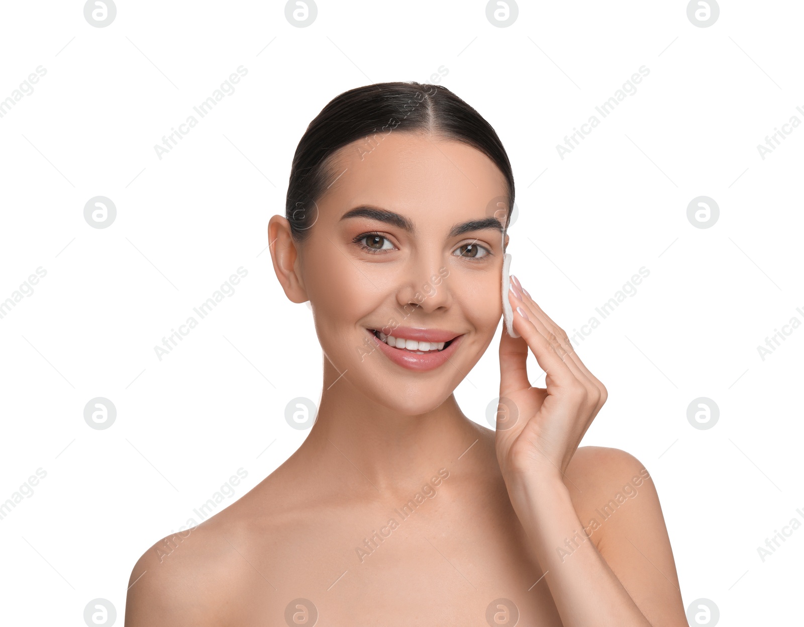 Photo of Beautiful woman removing makeup with cotton pad on white background