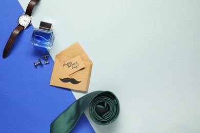 Photo of Card with phrase Happy Father's Day and different men accessories on color background, flat lay. Space for text