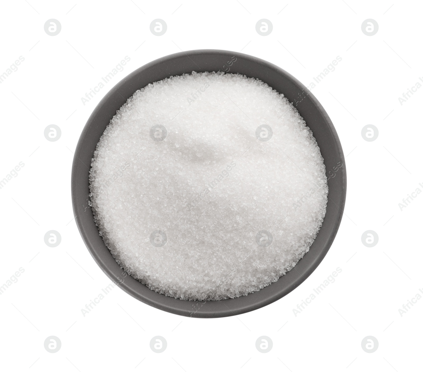 Photo of Bowl of granulated sugar isolated on white, top view