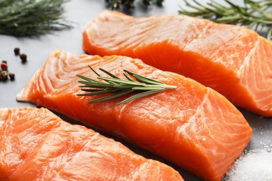 Photo of Fresh salmon and ingredients for marinade on grey table