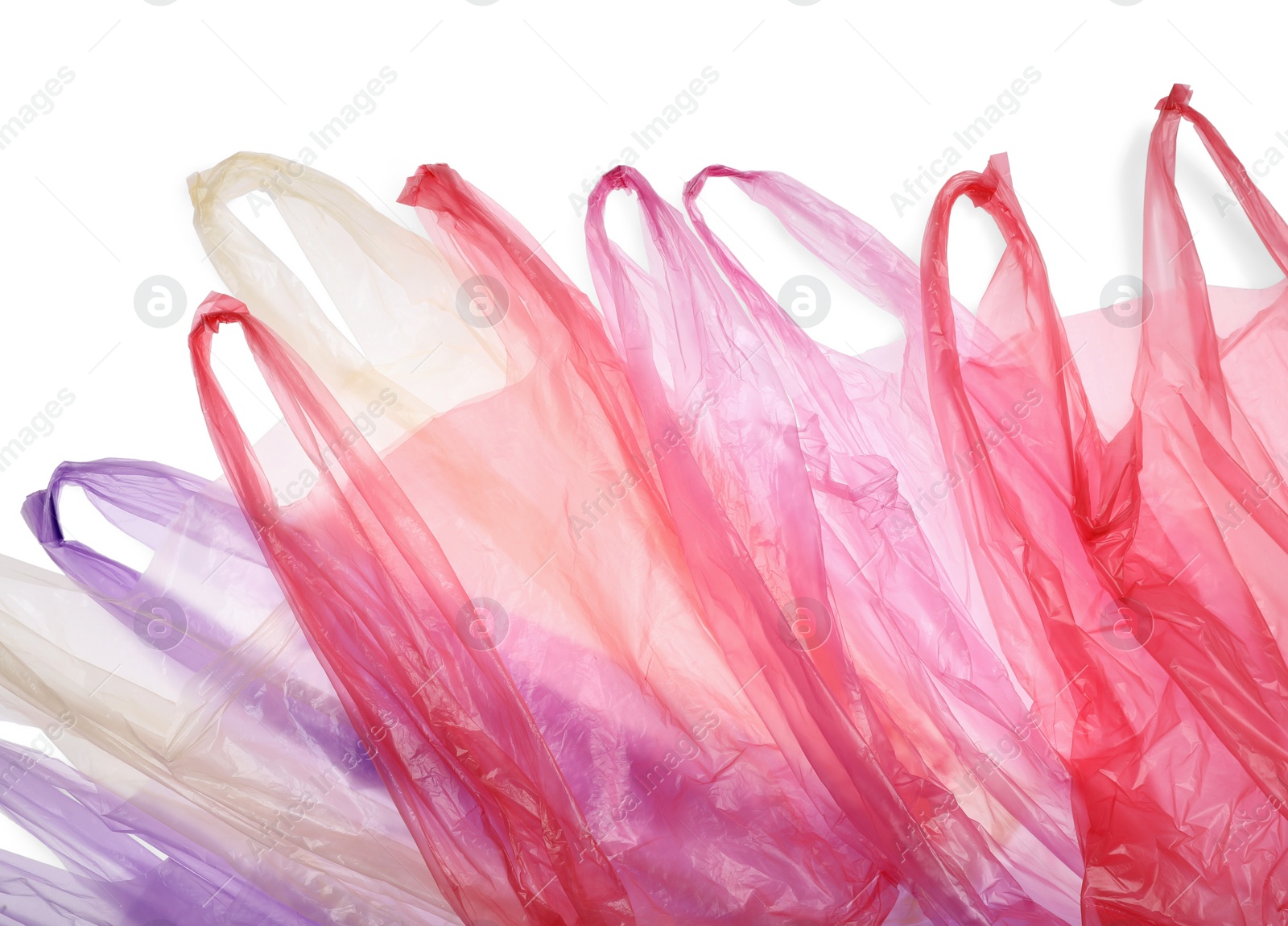 Photo of Many different plastic bags on white background