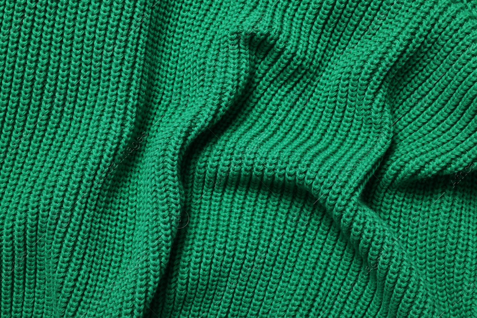 Photo of Texture of soft green fabric as background, top view