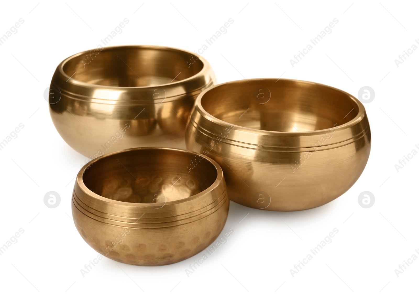 Photo of Three Tibetan singing bowls on white background