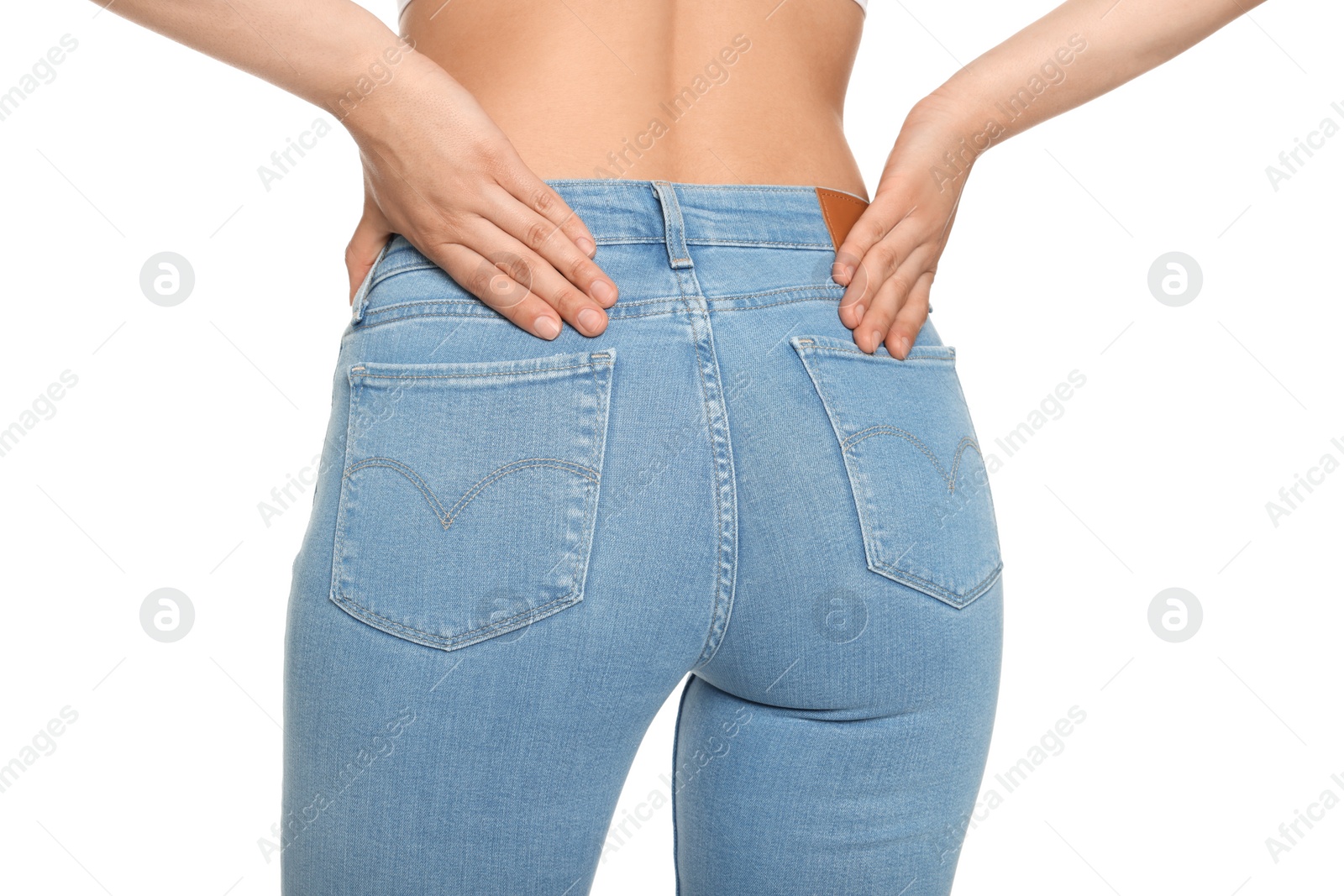 Photo of Woman wearing stylish light blue jeans on white background, closeup