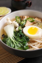 Bowl of vegetarian ramen on table, closeup