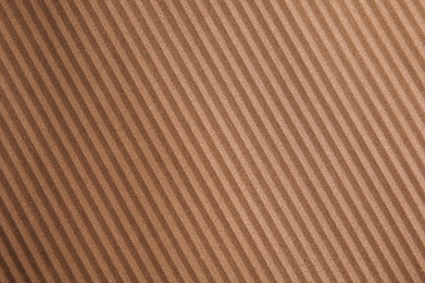 Photo of Brown corrugated sheet of cardboard as background, top view