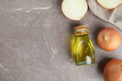 Photo of Flat lay composition with onion syrup and space for text on table