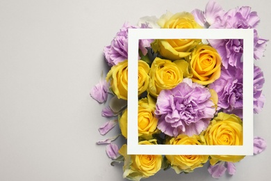 Photo of Flat lay composition with beautiful blooming flowers on grey background