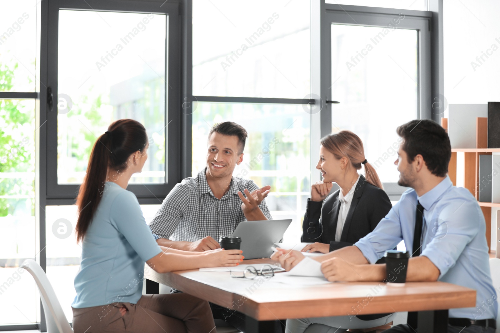 Photo of Office employees having business training at workplace