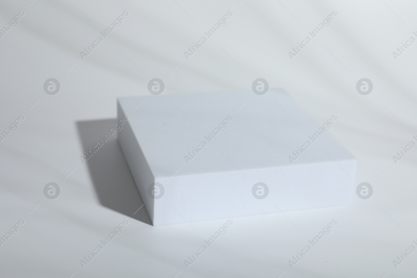 Photo of Presentation of product. Podium on white background, space for text
