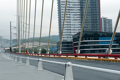 Photo of View of beautiful modern bridge near city