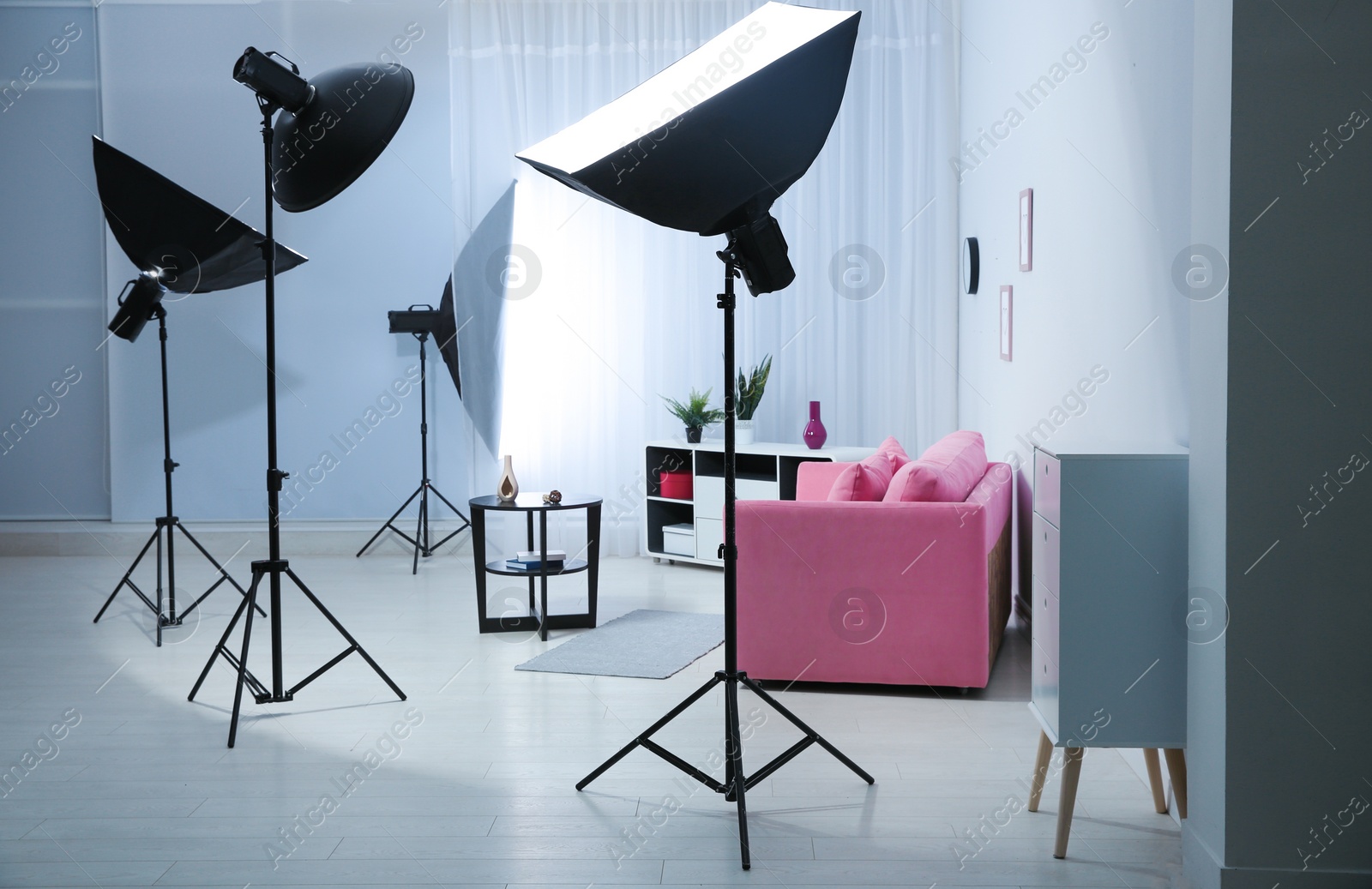 Photo of Example of living room interior design and professional equipment in photo studio