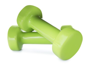 Photo of Color dumbbells on white background. Home fitness