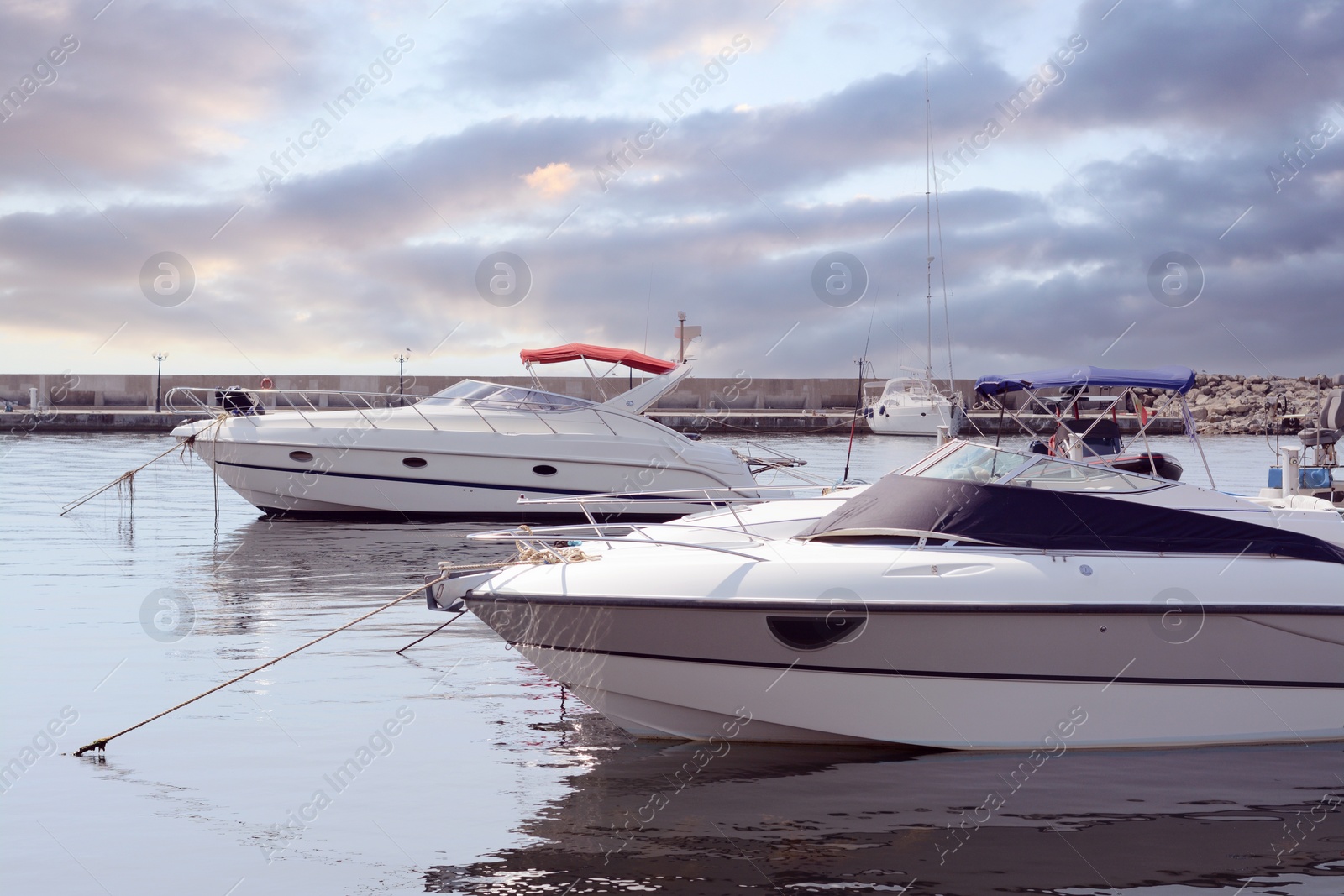 Photo of Beautiful view of city pier with moored boats on sunny day